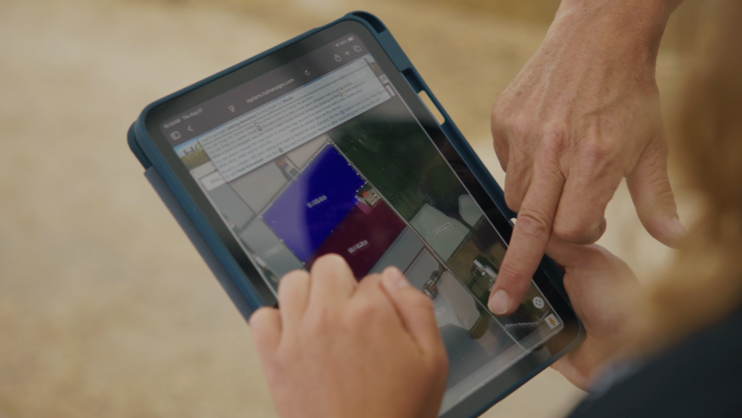 a hand holding a tablet